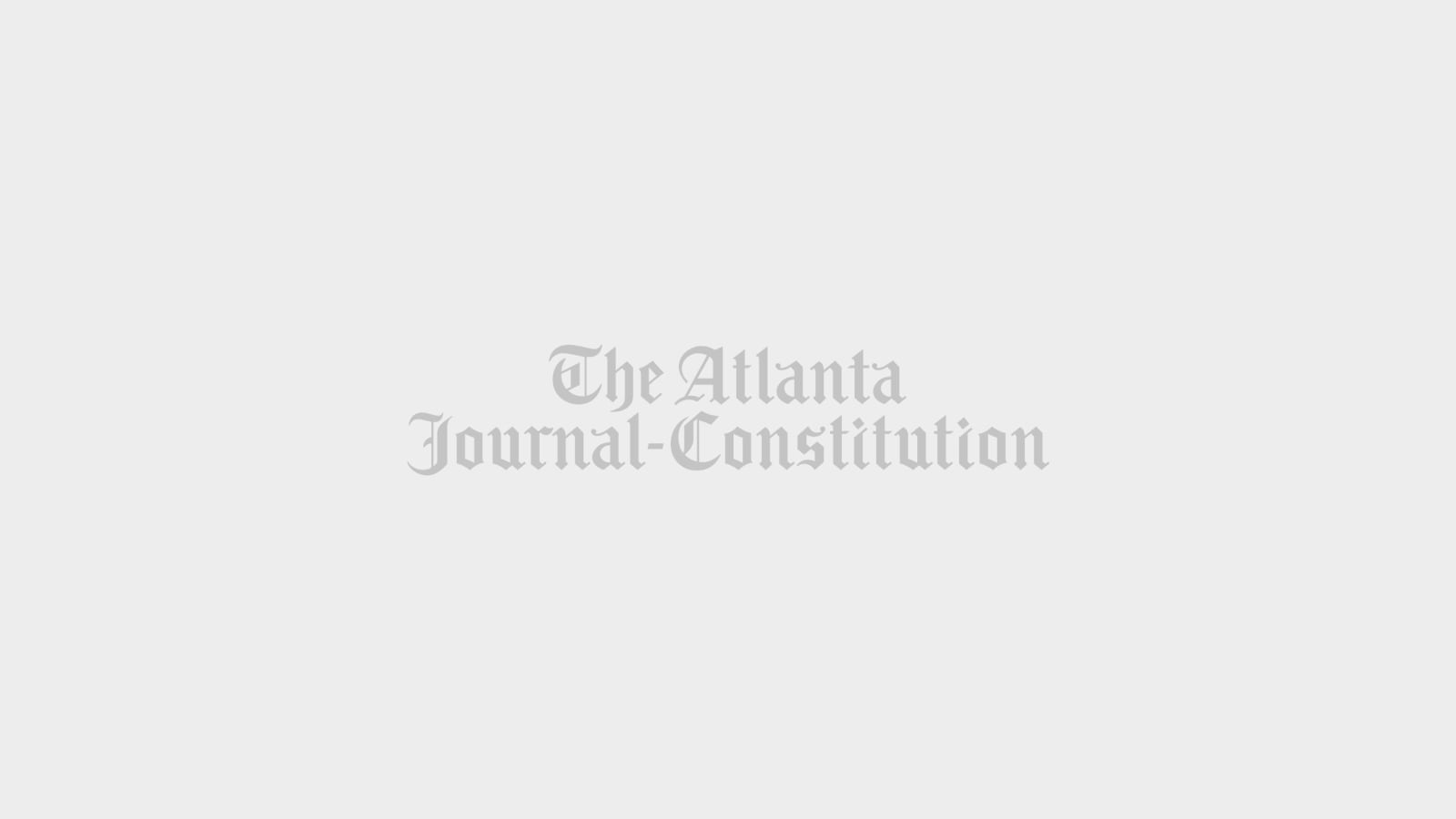 Mecklenburg County Public Health Department employees Tyler Green, right, and Erika De La Hoya, set up for the monkeypox vaccination clinic in Charlotte, N.C., Saturday, Aug. 20, 2022. (AP Photo/Nell Redmond)