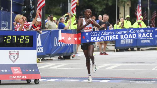 Rhonex Kipruto wins in the Men's Elite division of the 53rd running of the Atlanta Journal-Constitution Peachtree Road Race in Atlanta on Monday, July 4, 2022. (Curtis Compton / Curtis.Compton@ajc.com)