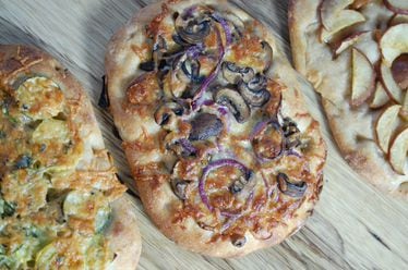 Pinsa Romana pizza hails from Rome, and is an easy-to-make, versatile flatbread for sweet and savory toppings. / Meridith Ford for the AJC