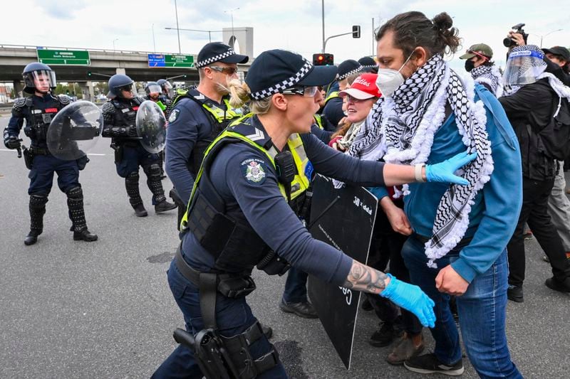 Victoria Police clash with anti-war protesters outside a military arms convention in downtown Melbourne, Australia,Wednesday, Sept. 11, 2024. (Joel Carret/AAP Image via AP)