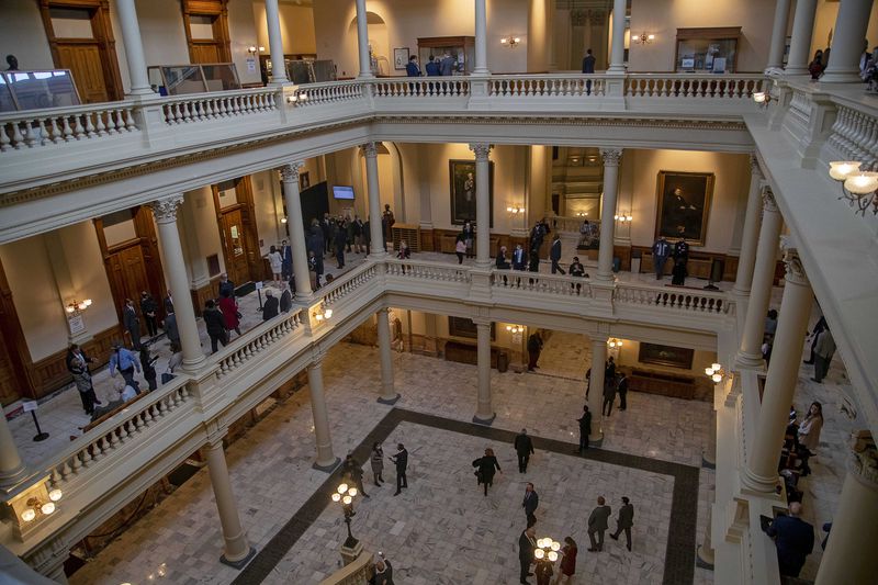 Lawmakers, lobbyists and guests roam the Georgia Capitol on Monday, the first day of 2021 legislative session. Voting laws will be a key issue of the session. "That’s front and center,” Gov. Brian Kemp said. (Alyssa Pointer / Alyssa.Pointer@ajc.com)
