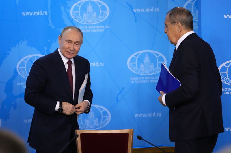 Russian President Vladimir Putin, left, and Russian Foreign Minister Sergey Lavrov leave a meeting at the Russian Foreign Ministry in Moscow, Russia, Friday, June 14, 2024. (AP Photo/Alexander Zemlianichenko)