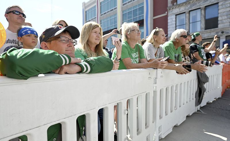 Dave Ondo and Kristle Ondo of Munster, Ind., watch as Indiana State University and Boston Celtics great Larry Bird speaks during the grand opening ceremony for the Larry Bird Museum, Thursday, May 30, 2024, in Terre Haute, Ind. (Joseph C. Garza/The Tribune-Star via AP)