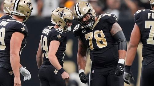 New Orleans Saints place-kicker Blake Grupe (19) is congratulated by center Erik McCoy (78) after a field goal during the first half of an NFL football game against the Carolina Panthers, Sunday, Sept. 8, 2024, in New Orleans. (AP Photo/Gerald Herbert)