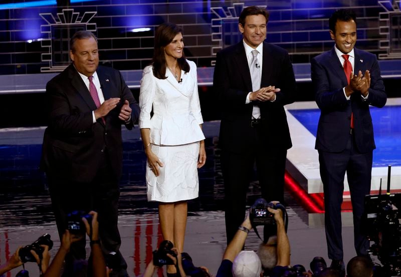 Former New Jersey Gov. Chris Christie, from left, former South Carolina Gov. Nikki Haley, Florida Gov. Ron DeSantis of Florida, entrepreneur Vivek Ramaswamy, and South Carolina U.S. Sen. Tim Scott take the stage for the third Republican presidential debate in November in Miami. Christie has used the debates to attack former President Donald Trump, the GOP front-runner, who has not participated in the events. He also has attacked Ramaswamy as a blowhard who, he said, "is playing the role of a younger Donald Trump on that stage.” (Scott McIntyre/The New York Times)
                      
