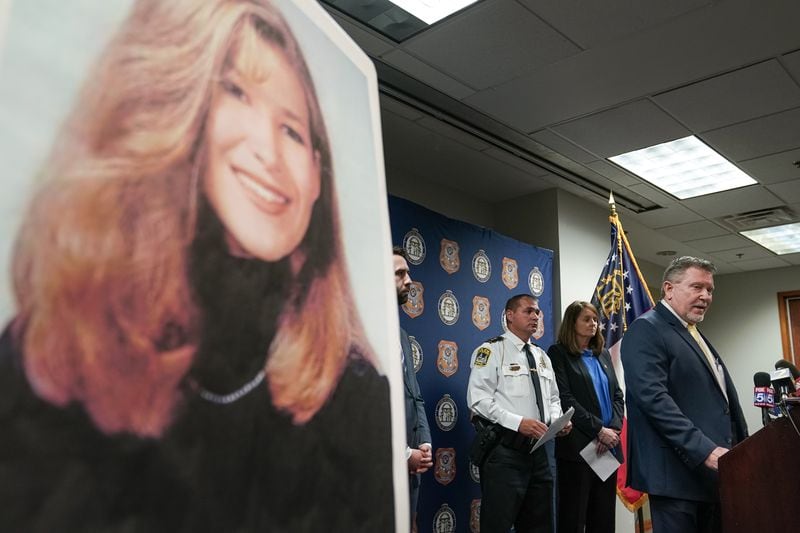 A photo of UGA law student Tara Louise Baker is seen as Chris Hosey, Director of the Georgia Bureau of Investigation, speaks during a press conference announcing an arrest in the student's 23-year-old cold case death on Monday, May 13, 2024, in Decatur. (Elijah Nouvelage for The Atlanta Journal-Constitution)