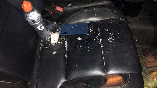 A photo from the scene of Robert Lewis Anderson's arrest shows methamphetamine scattered around a car seat.