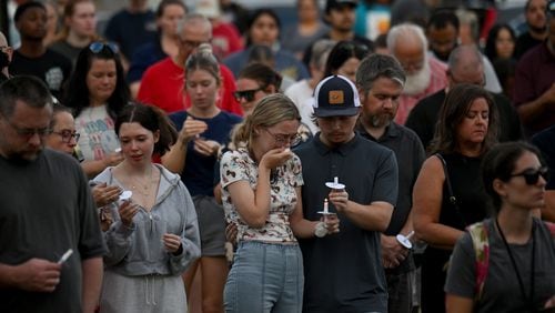 Community members and leaders came together Wednesday during a candlelight vigil at Jug Tavern Park in Winder. Four people were killed and nine others were taken to various hospitals after a shooting earlier in the day at Apalachee High School in Barrow County. (Hyosub Shin / AJC)