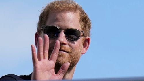 FILE - Britain's Prince Harry, the Duke of Sussex, waves during the Formula One U.S. Grand Prix auto race at Circuit of the Americas, on Oct. 22, 2023, in Austin, Texas. (AP Photo/Nick Didlick, File)