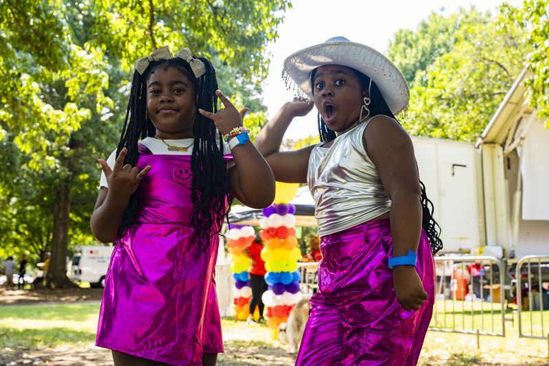 Sisters, Royal Z (left), and Zoey Fierce (right) practice their dance performance together at the Pure Heat Community Festival in Piedmont Park on Sunday, Sept. 1, 2024.  (Olivia Bowdoin for the AJC). 