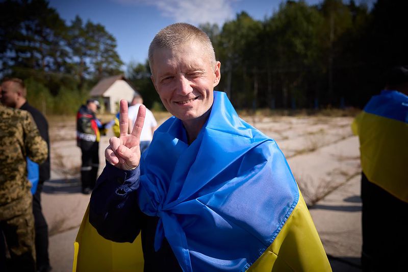 A Ukrainian reacts after being released in a prisoner exchange at an undisclosed location in Ukraine, Saturday Sept. 14, 2024. (Ukrainian Presidential Press Office via AP)