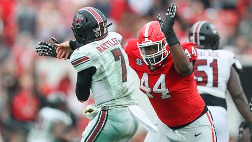 Georgia defensive lineman Jordan Hall (44) hits South Carolina quarterback Spencer Rattler (7) after Rattler attempts a pass during their game at Sanford Stadium, Saturday, September 16, 2023, in Athens, Ga. Georgia won 24-14.  (Jason Getz / Jason.Getz@ajc.com)