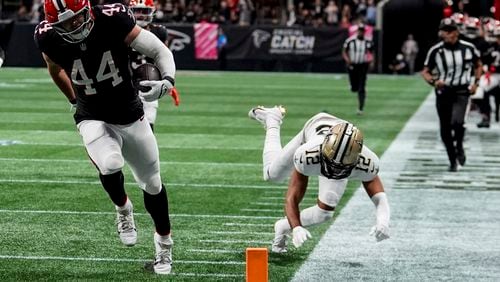 Atlanta Falcons linebacker Troy Andersen (44) runs into the end zone on an interception against the New Orleans Saints during the first half of an NFL football game, Sunday, Sept. 29, 2024, in Atlanta. (AP Photo/John Bazemore)