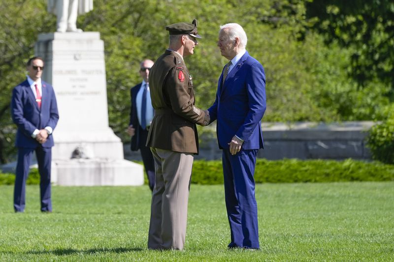 President Joe Biden, right, is greeted by Lt. General Steve Gillard, left, Superintendent at the U.S. Military Academy at West Point, Saturday, May 25, 2024, in West Point, N.Y. (AP Photo/Alex Brandon)