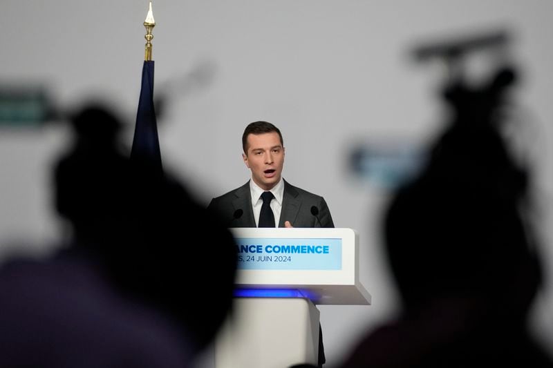 Far-right National Rally party president Jordan Bardella gives a press conference, Monday, June 24, 2024 in Paris. The upcoming two-round parliamentary election will take place on June 30 and July 7. (AP Photo/Christophe Ena)