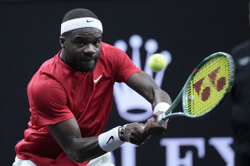 Team World's Frances Tiafoe returns to Team Europe's Alexander Zverev on the third day of the Laver Cup tennis tournament, at the Uber arena in Berlin, Germany, Sunday, Sept. 22, 2024. (AP Photo/Ebrahim Noroozi)