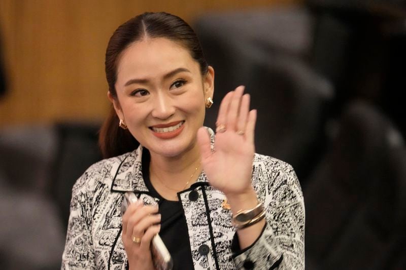 Leader of Pheu Thai Party, Paetongtarn Shinawatra, daughter of Thailand's former Prime Minister Thaksin Shinawatra, wave before press conference in Bangkok, Thailand, Thursday, Aug. 15, 2024. (AP Photo/Sakchai Lalit)