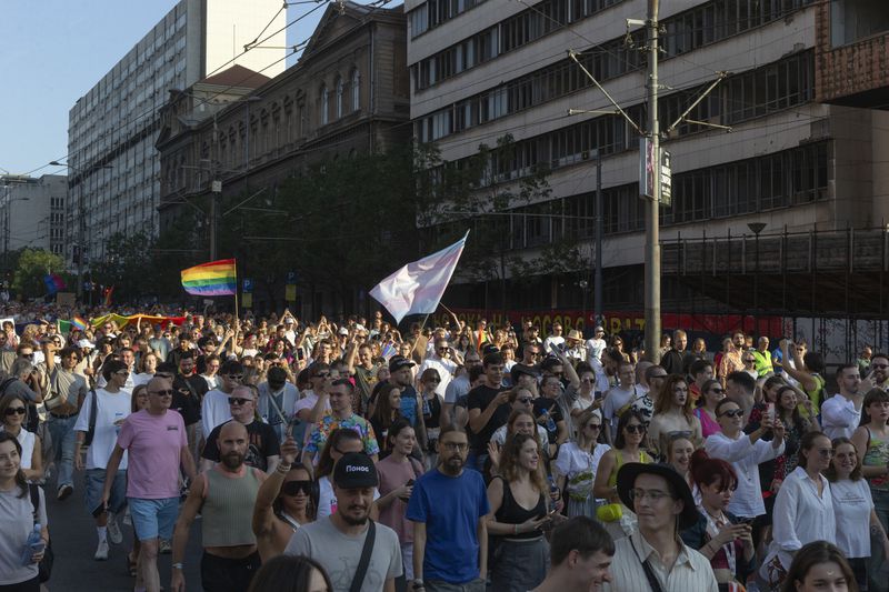 People attend a pride march in Belgrade, Serbia, Saturday, Sept. 7, 2024 as they demand that the government improve rights for the LGBTQ+ community who often face harassment and discrimination in the highly conservative Balkan country. (AP Photo/Marko Drobnjakovic)