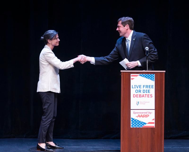 Democratic congressional candidates Maggie Goodlander, left, and Colin Van Ostern shake hands after the Live Free or Die Debates at the Rosamond Page Putnam Center for the Performing Arts on the campus of New England College in Henniker, N.H., Wednesday evening, Sept. 4, 2024. (Geoff Forester/The Concord Monitor via AP)