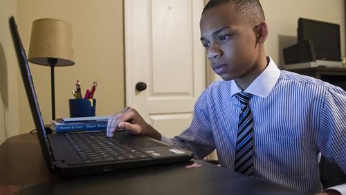 C.J. Pearson, 13, has become a conservative sensation for his biting attacks on Democratic policies. (AJC file)