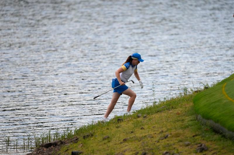 Europe's Leona Maguire climbs up after chipping onto the 11th green during a Solheim Cup golf tournament fourball match at Robert Trent Jones Golf Club, Friday, Sept. 13, 2024, in Gainesville, Va. (AP Photo/Matt York)