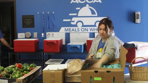 Sierra Bastis, a 22-year-old University of Georgia student and an intern at the Athens Community Council on Aging, prepares groceries for older adults in Athens, Georgia, on Tuesday, Nov. 7, 2023.  In Georgia, 11% of adults over 60 live in poverty and 8.3% are food insecure, according to Georgia’s Division of Aging Services. (Photo Courtesy of Lilly Kersh)