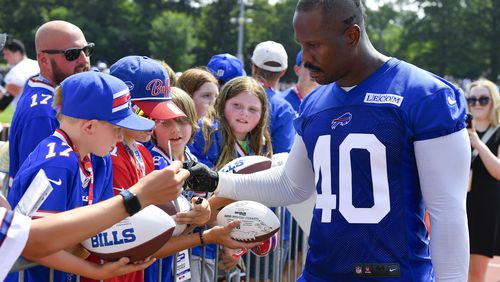 Buffalo Bills linebacker Von Miller (40) signs autographs after an NFL football training camp practice in Pittsford, N.Y., Wednesday, July 24, 2024. (AP Photo/Adrian Kraus)