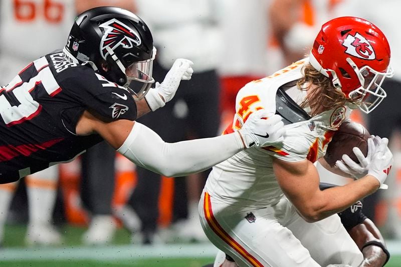 Atlanta Falcons linebacker Kaden Elliss (55) tackles Kansas City Chiefs running back Carson Steele (42) during the first half of an NFL football game, Sunday, Sept. 22, 2024, in Atlanta. (AP Photo/Brynn Anderson)