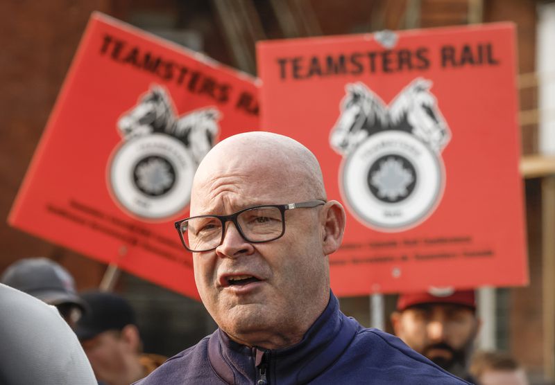 Sean O'Brien, General President, International Brotherhood of Teamsters, speaks to media as picketing rail workers gather at the CPKC headquarters in Calgary, Alta., Friday, Aug. 23, 2024.(Jeff McIntosh /The Canadian Press via AP)