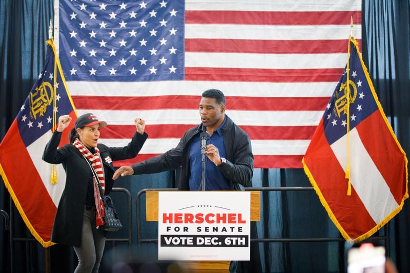 Republican Herschel Walker with his wife Julie Blanchard during a campaign event in Ellijay, Ga. on Dec. 5, 2022. (Dustin Chambers/The New York Times)
