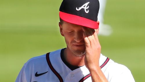 Braves starting pitcher Drew Smyly reacts after giving up a two-run homer to Arizona's David Peralta during the first inning  of the second game of a doubleheader Sunday, April 25, 2021, at Truist Park.  Smyly gave up five runs in the opening frame of a 7-0 loss. (Curtis Compton / Curtis.Compton@ajc.com)