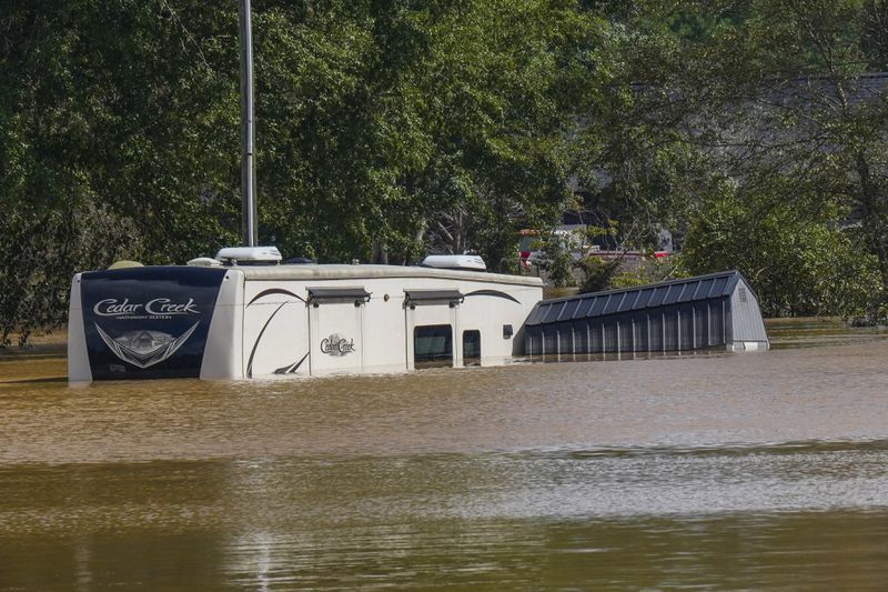 FILE - The Riverside RV park was flooded from the overflowing Catawba River after torrential rain from Hurricane Helene, Sept. 28, 2024, in Morganton, N.C. (AP Photo/Kathy Kmonicek, File)