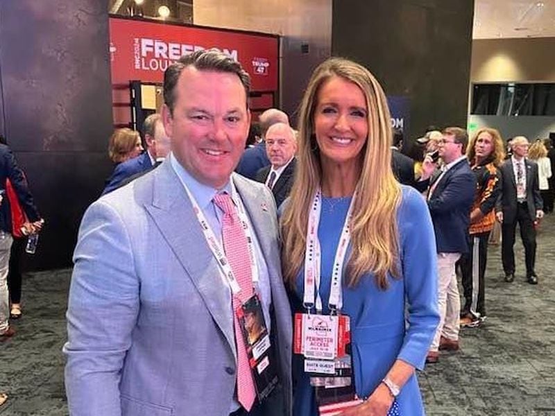 Georgia Lt. Gov. Burt Jones (left) and former U.S. Sen. Kelly Loeffer, R-Ga. (right), pose for a photo at the Republican National Convention in Milwaukee.