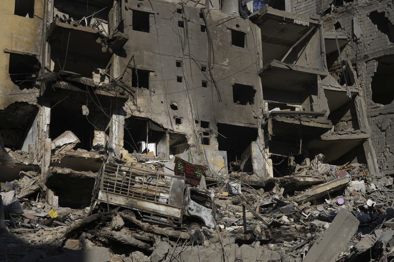 Crumbled buildings at the site of the assassination of Hezbollah leader Hassan Nasrallah in Beirut's southern suburbs, Sunday, Sept. 29, 2024. (AP Photo/Hassan Ammar)