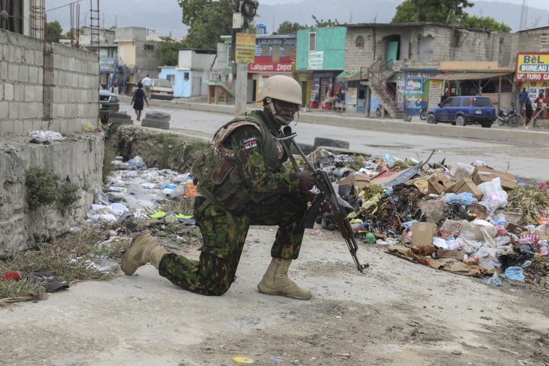 A Kenyan police officer patrols the area near the international airport in Port-au-Prince, Haiti, Wednesday, July 3, 2024. (AP Photo/Odelyn Joseph)