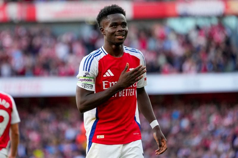 Arsenal's Bukayo Saka celebrates after scoring his side's third goal during the English Premier League soccer match between Arsenal and Southampton at the Emirates Stadium in London, Saturday, Oct. 5, 2024. (AP Photo/Kirsty Wigglesworth)