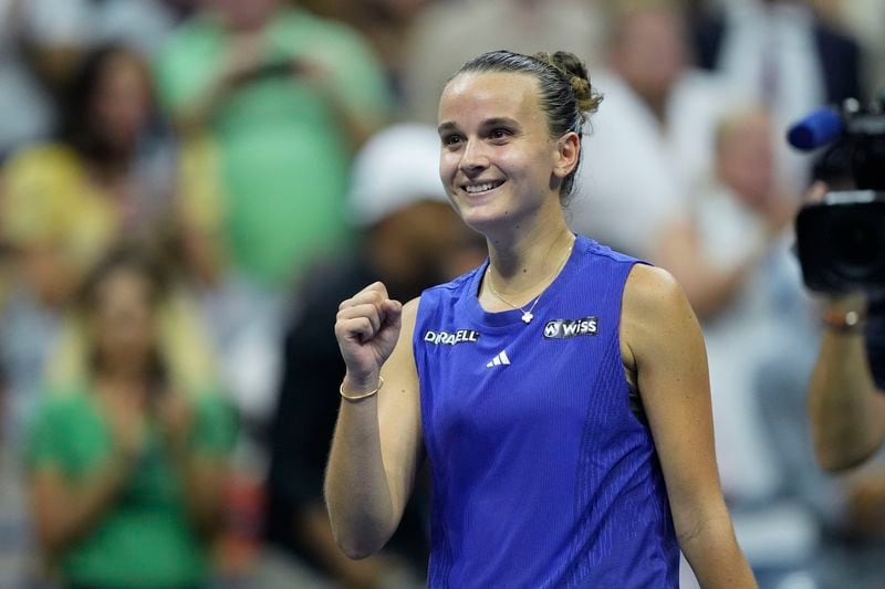 Clara Burel, of France, reacts against Sloane Stephens, of the United States, during a first round match of the U.S. Open tennis championships, Monday, Aug. 26, 2024, in New York. (AP Photo/Matt Rourke)