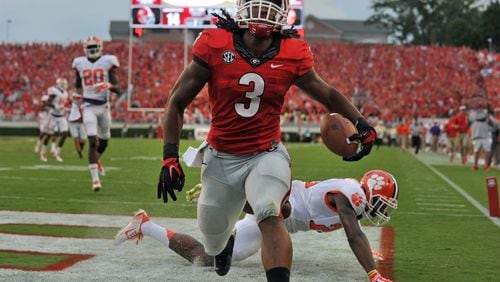 August 30, 2014 Athens, GA: Georgia Bulldogs running back Todd Gurley scores on 100-yard kickoff return against Clemson during the first half Saturday August 30, 2014 in Athens.  BRANT SANDERLIN / BSANDERLIN@AJC.COM 
.