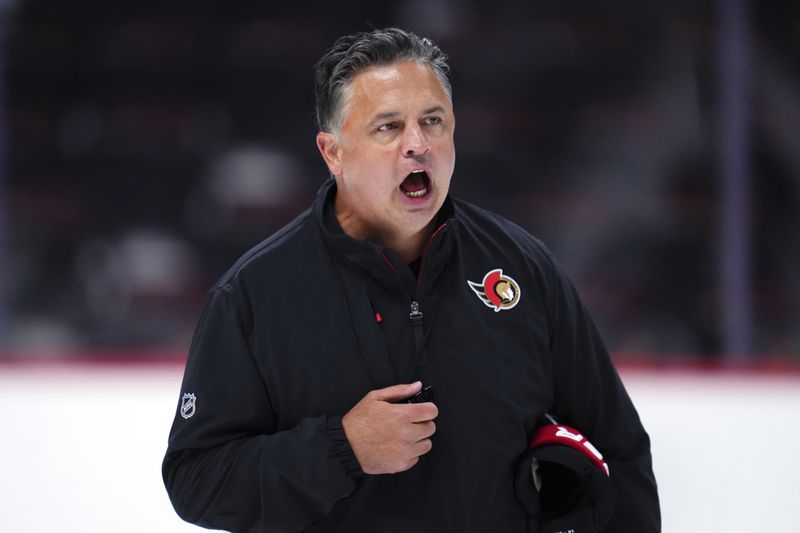 Ottawa Senators head coach Travis Green yells instructions to his players during NHL hockey training camp in Ottawa, Ontario, Thursday, Sept. 19, 2024. (Sean Kilpatrick/The Canadian Press via AP)