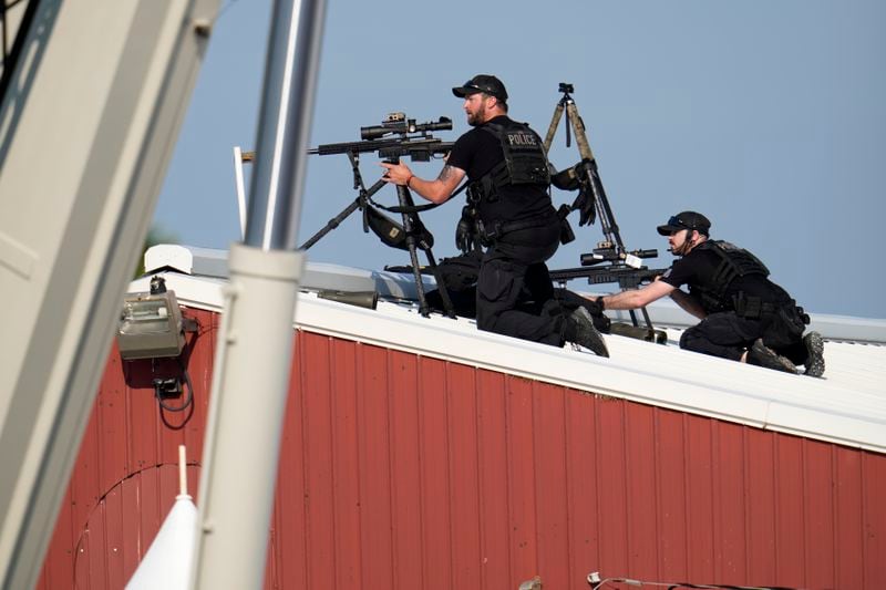 FILE - Police snipers return fire after shots were fired while Republican presidential candidate former President Donald Trump was speaking at a campaign event in Butler, Pa., July 13, 2024. (AP Photo/Gene J. Puskar, File)