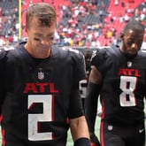 Falcons quarterback Matt Ryan and tight end Kyle Pitts walk off the field dejected after falling 34-30 to the Washington Football Team Sunday, Oct. 3, 2021, at Mercedes-Benz Stadium in Atlanta. (Curtis Compton / Curtis.Compton@ajc.com)