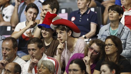 A group of fans shush the crowd as the "Shh Cam" scans the audience during the mens' United States versus France goalball game during the Paralympic Games in Paris on Saturday, Aug. 31, 2024. Football fans are known for being loud and rowdy. But the Paralympic sports most closely related to football, blind football and goalball, require spectators to be silent during game action so that players can receive audible cues from the ball and the environment. (AP Photo/Felix Scheyer)