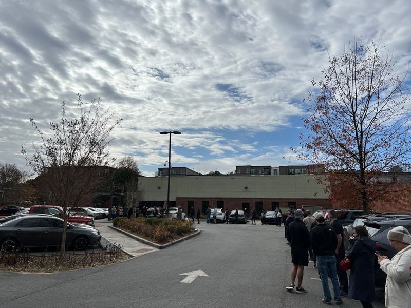 At the North DeKalb Senior Center. The wait time on the county website was reported at 10 minutes shortly after noon Friday, but the line was wrapped around the parking lot. (Henri Hollis / AJC)