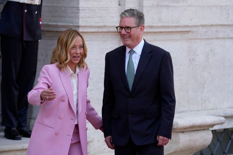 Italian Premier Giorgia Meloni, left, welcomes U.K. Prime Minister Keir Starmer as they meet at Villa Panphilj in Rome, Monday, Sept. 16, 2024. U.K. Prime Minister Keir Starmer is meeting Italian Premier Giorgia Meloni in Rome on Monday, as the two very different politicians, from left and right, seek common cause to curb migrants reaching their shores by boat. The visit comes after at least eight seaborne migrants died off the French coast over the weekend. (AP Photo Andrew Medichini)