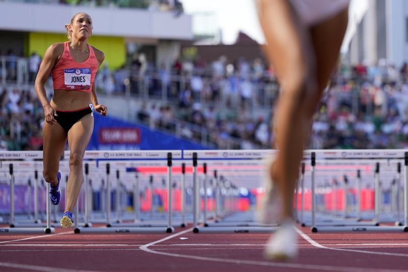Lolo Jones competes in a heat women's 100-meter hurdles during the U.S. Track and Field Olympic Team Trials Friday, June 28, 2024, in Eugene, Ore. (AP Photo/George Walker IV)