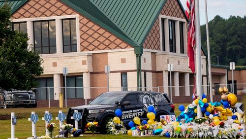 A memorial is seen at Apalachee High School after the Wednesday school shooting, Saturday, Sept. 7, 2024, in Winder, Ga. (AP Photo/Mike Stewart)