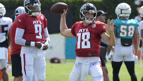 Atlanta Falcons quarterback Kirk Cousins (18) throws a pass during an NFL joint football practice with the Miami Dolphins at the team's practice facility, Tuesday, Aug. 6, 2024, in Miami Gardens, Fla. (AP Photo/Marta Lavandier)