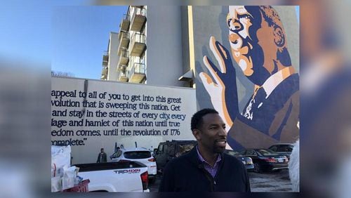 Atlanta City Councilman Andre Dickens speaks about Congressman John Lewis on Monday.