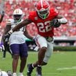 Georgia running back Branson Robinson (22) scores a 13-yard touchdown run during the third quarter against Tennessee Tech at Sanford Stadium, Saturday, Sept. 7, 2024, in Athens, Ga. Georgia won 48-3. (Jason Getz / AJC)
