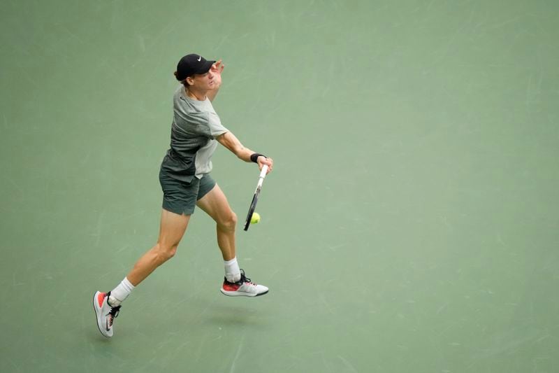 Jannik Sinner, of Italy, returns a shot to Taylor Fritz, of the United States, during the men's singles final of the U.S. Open tennis championships, Sunday, Sept. 8, in New York. 2024. (AP Photo/Frank Franklin II)